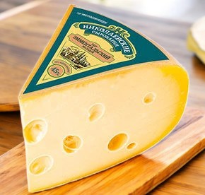 Сыр Эмментальский молодой с м.д.ж. 45,0% 1/8 цилиндра 1 кг Сыры Кубани