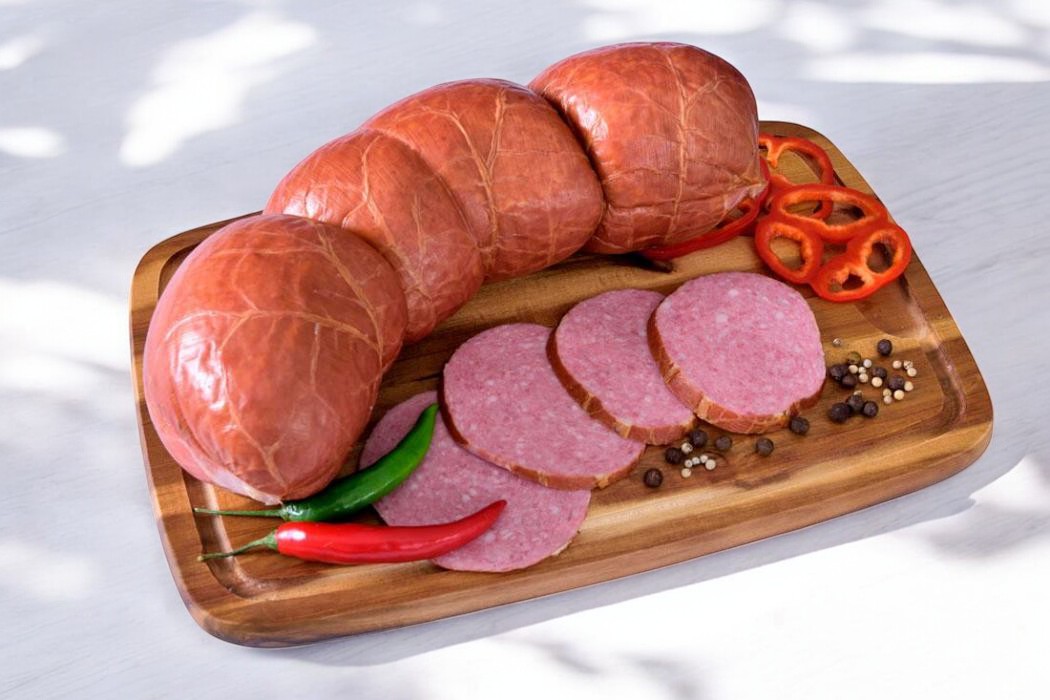 Колбасное изделие в/к колбаса мясная “Сервелат Купеческий” в/с вак пак (белкозин)